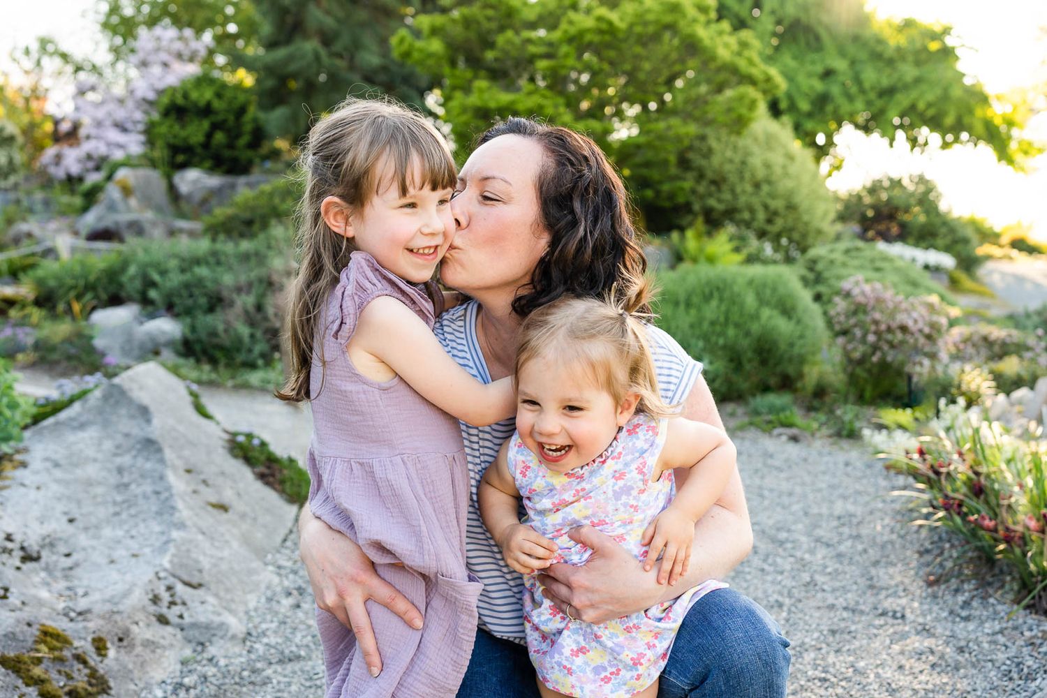 Mother kisses her daughter at Bellevue Botanical Garden.