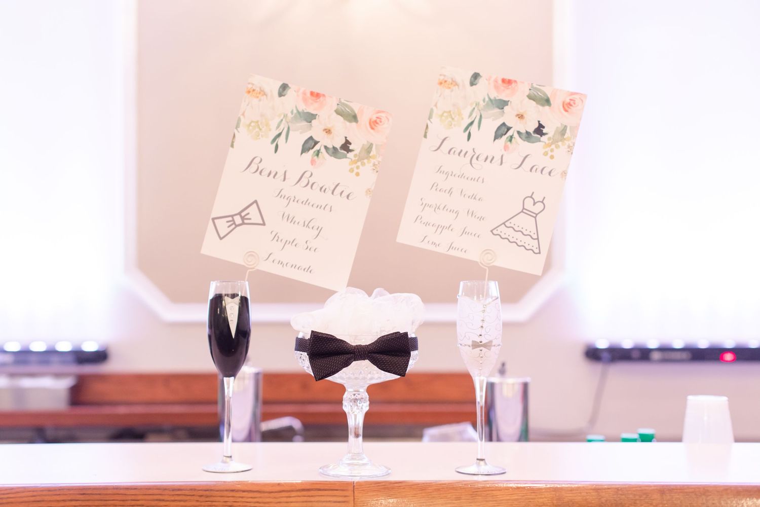 Wedding reception decor with personalized table cards and champagne flutes.