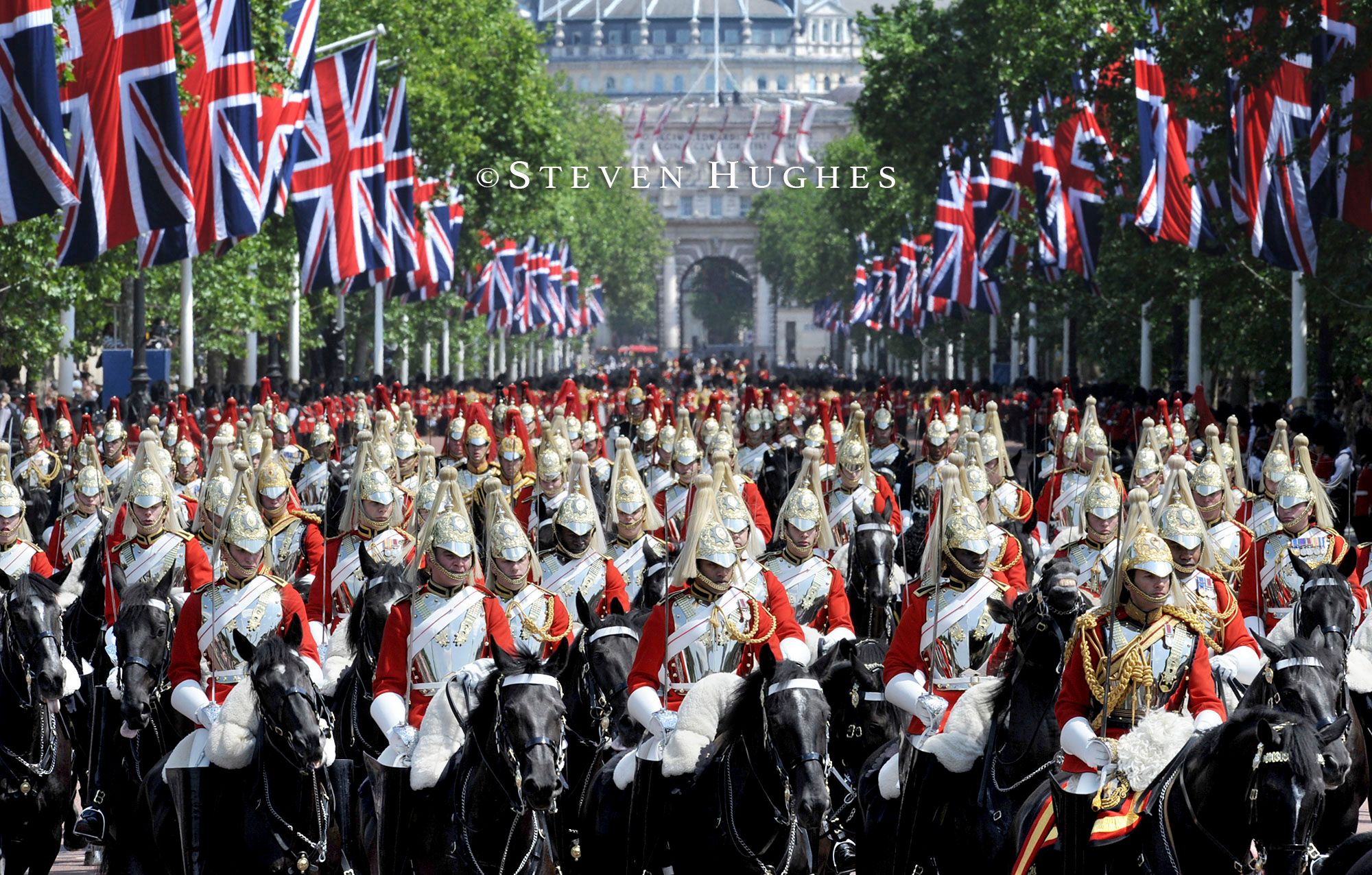 The Household Cavalry Mounted Regiment march up The Mall towards Buckingham Palace during Trooping the Colour.