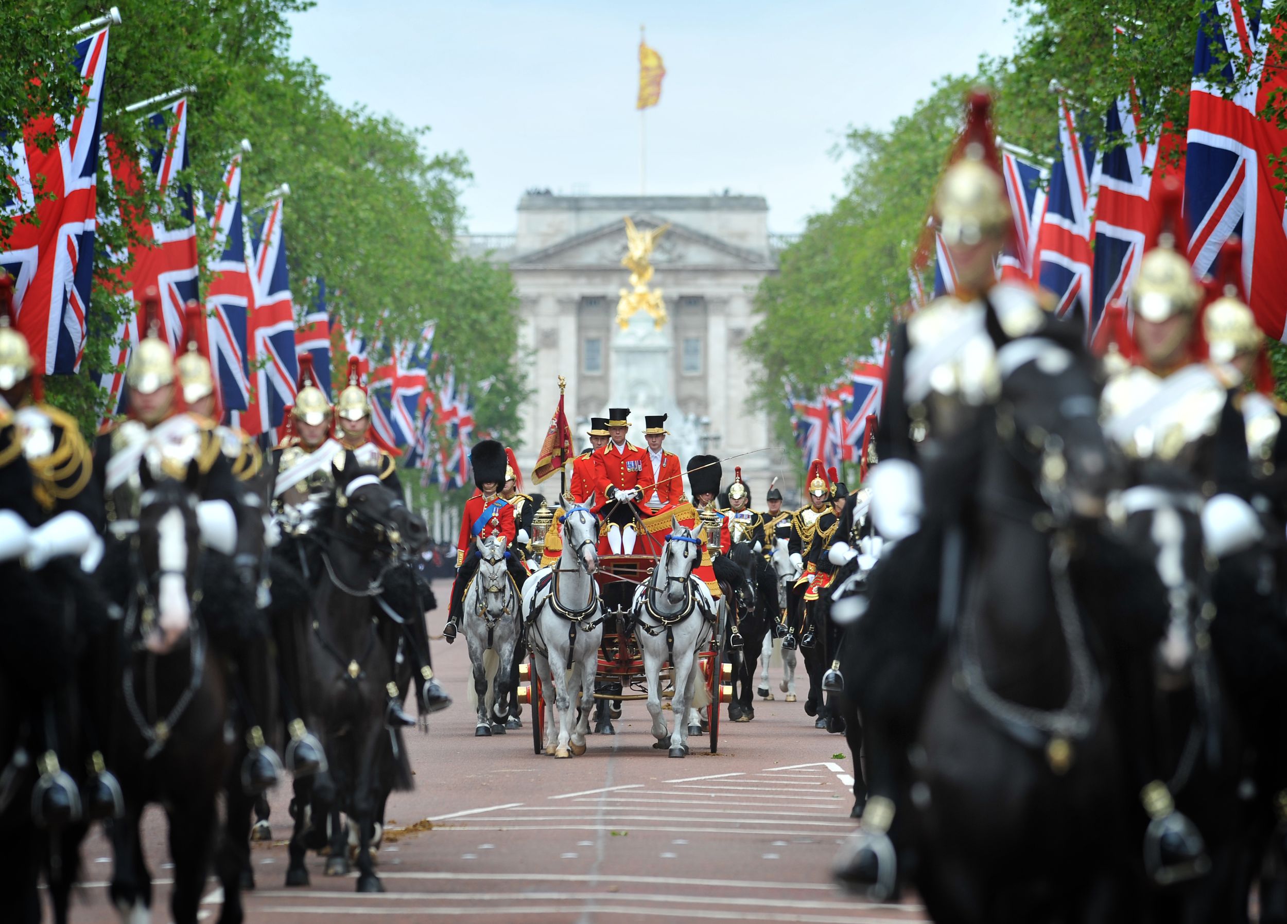 The Queens Royal Carriage maked its was down the Mall toowards Horse Guards.