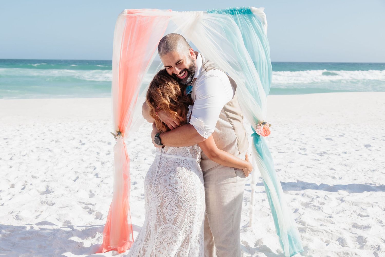 Destin Beach wedding summer daytime bride and groom hug