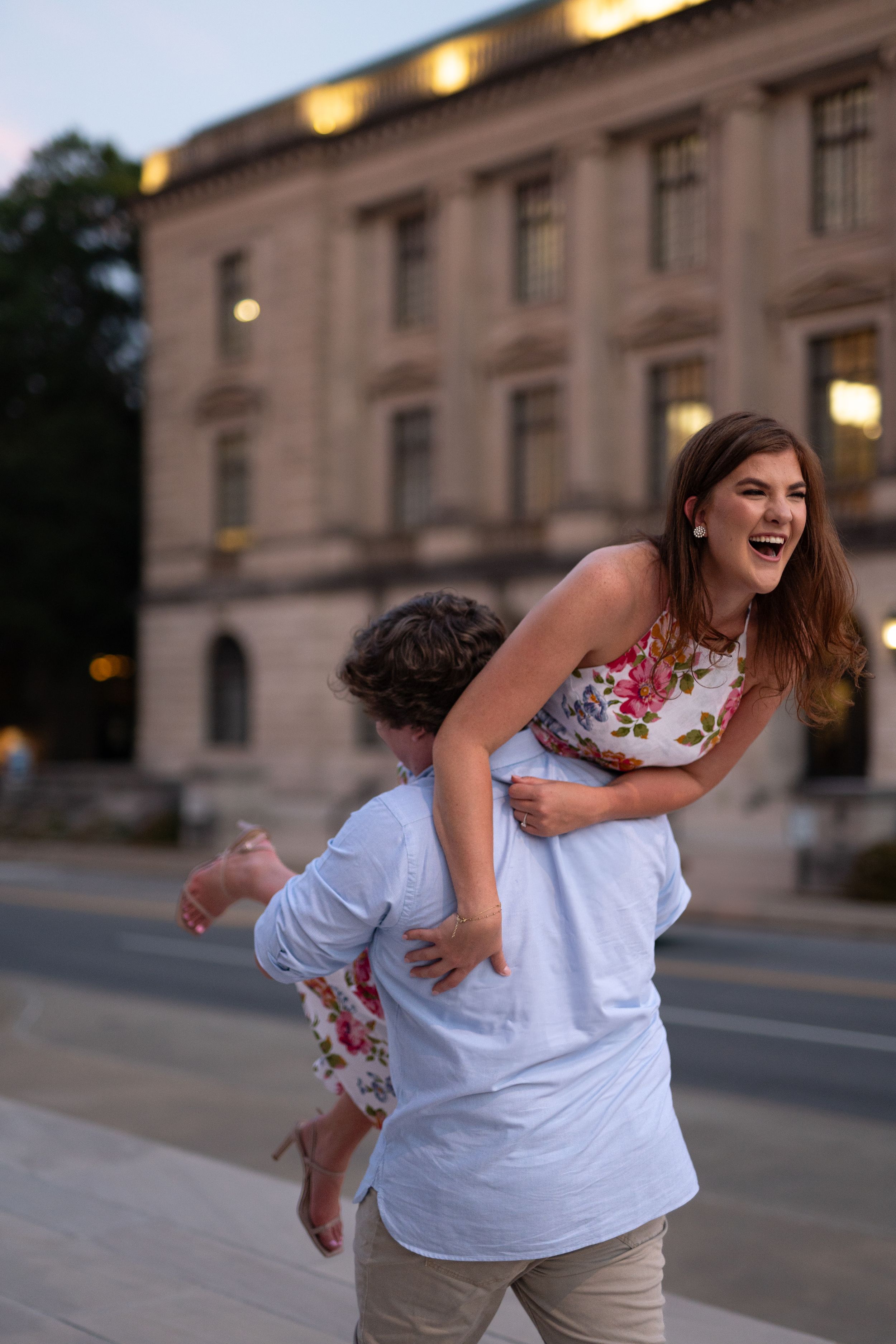 Candid sequence captures laughter and movement in front of a historic building as evening falls.