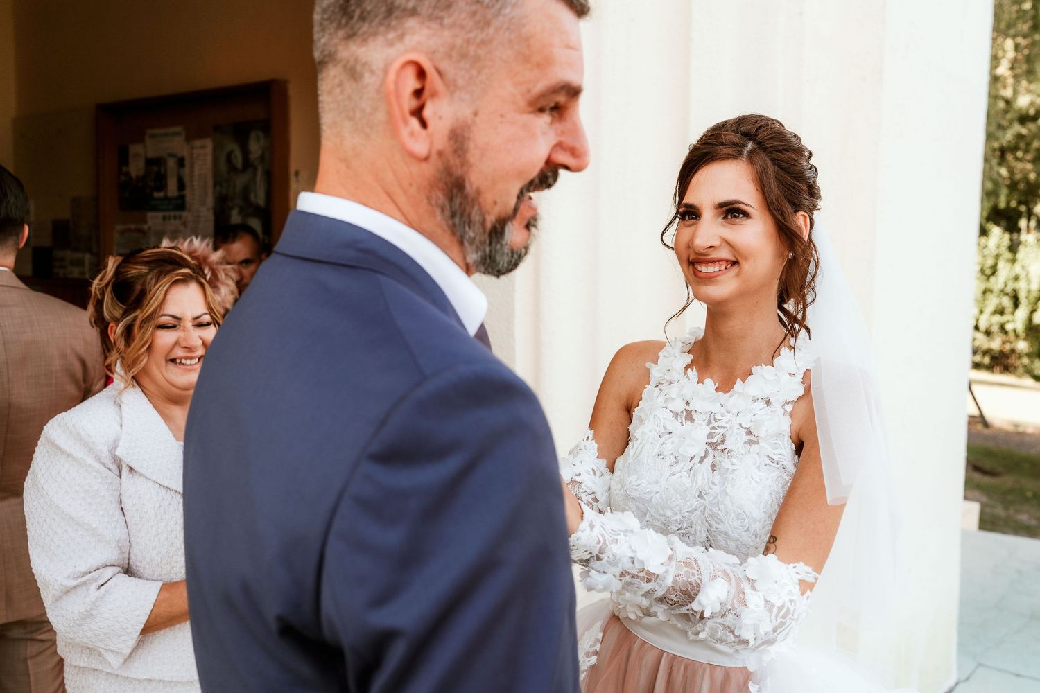 A touching moment between newlyweds as they exchange looks during their wedding day.
