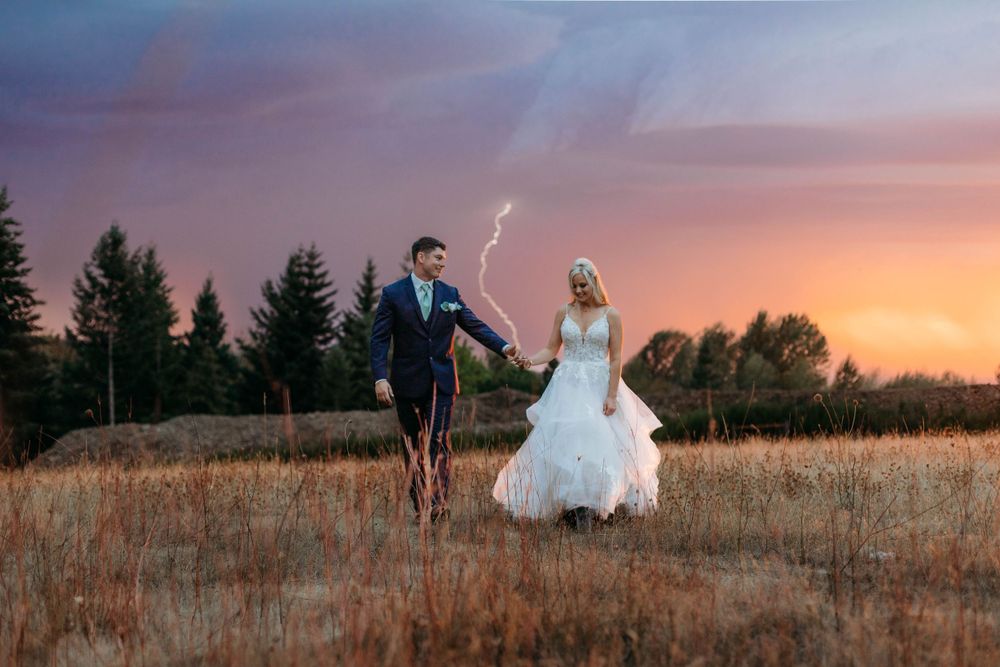 A romantic sunset photoshoot in a golden wheat field with dramatic lighting and flowing white dress.