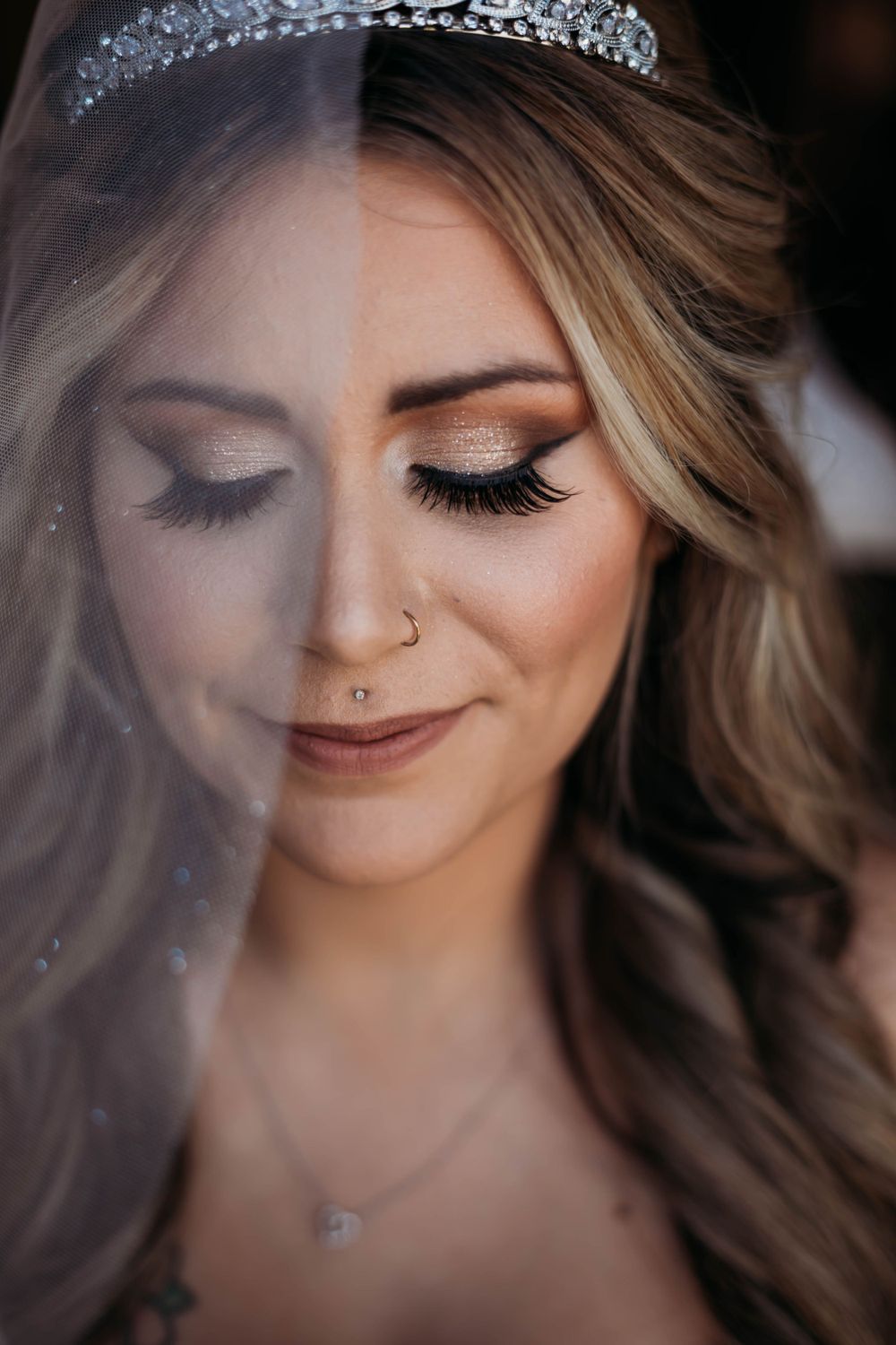 Close-up details of bridal makeup and jewelry with sparkly accessories.