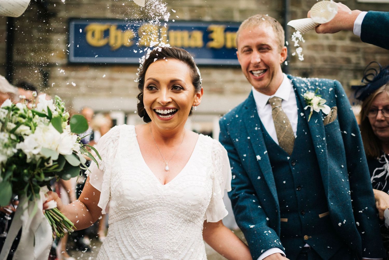 The Alma Inn wedding, bride in Eliza Jane Howell, beaded wedding dress, confetti shot