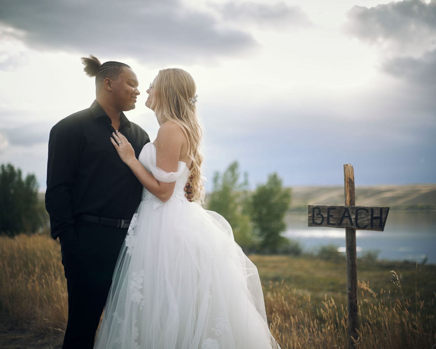 newlywed couple posing for photo