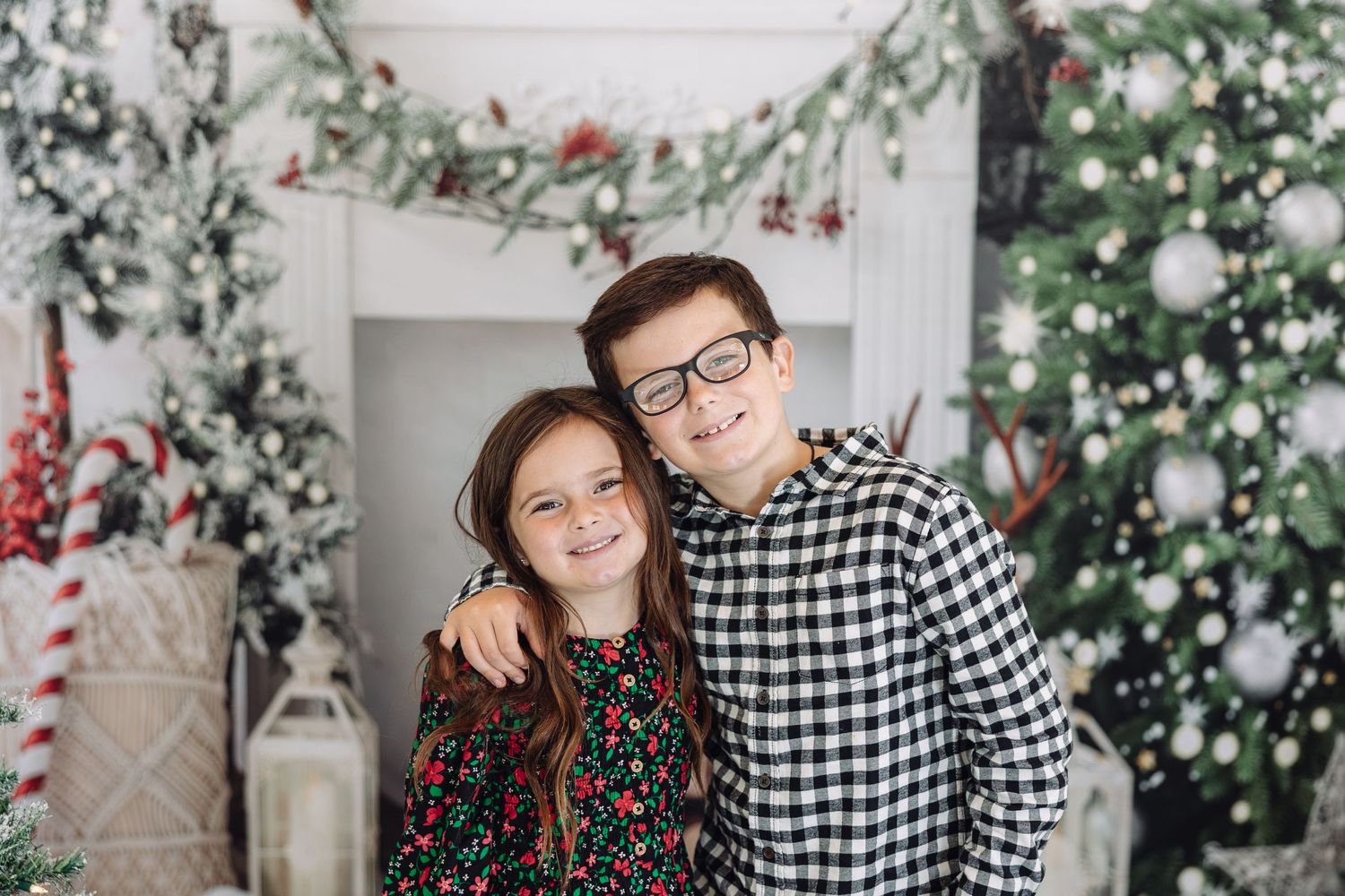 Festive holiday scene with decorated Christmas trees and twinkling lights.