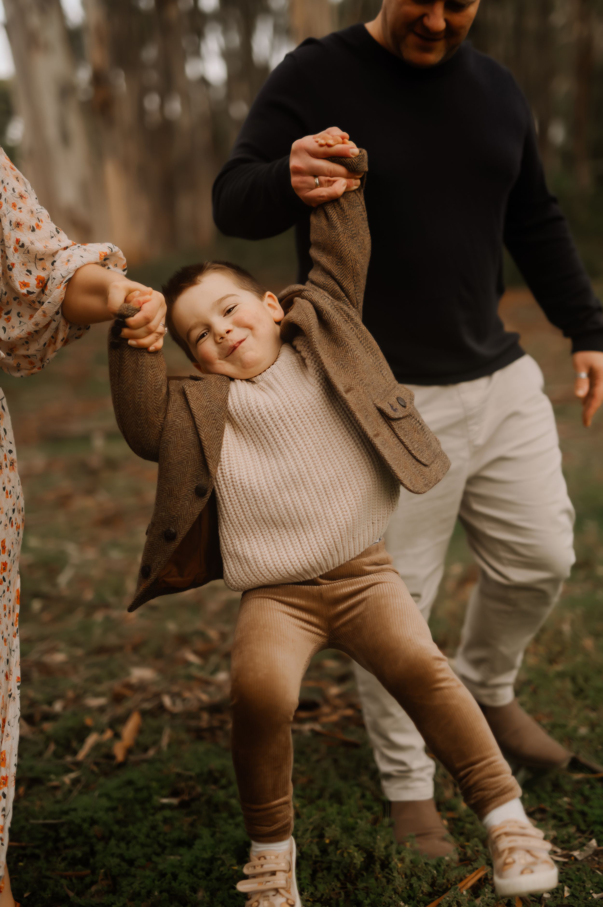 Candid moments of play and connection captured in a natural outdoor setting.