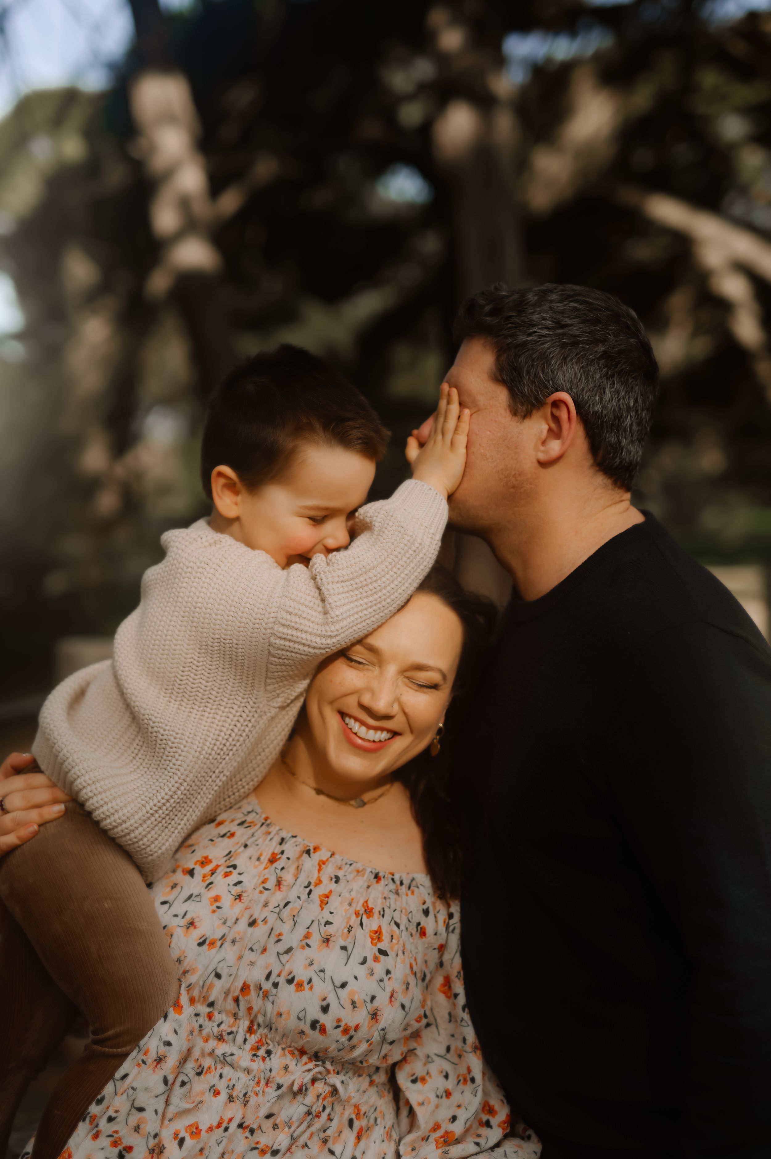 Warm, candid family moments captured in golden light showing authentic expressions of joy.