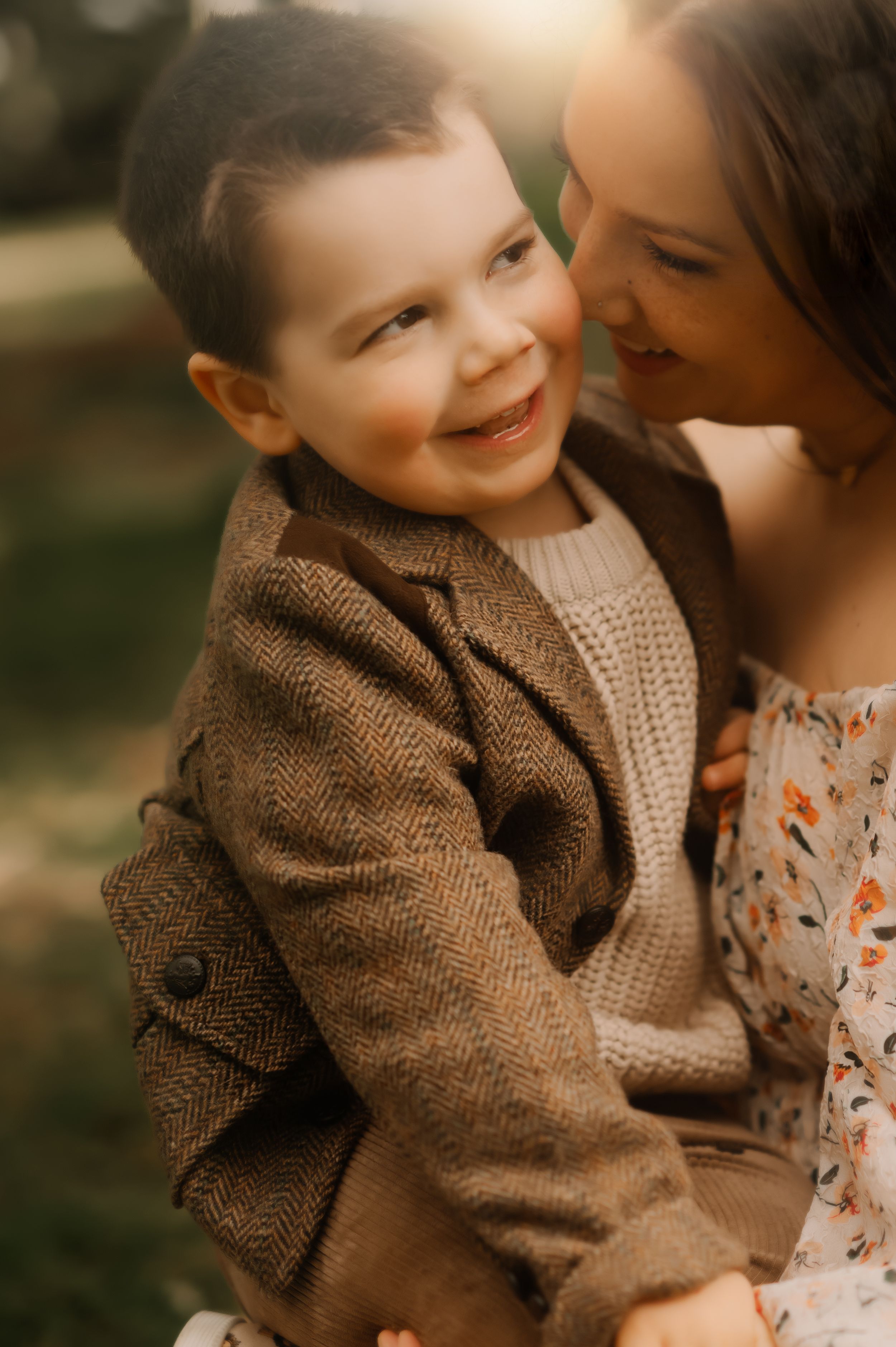 Sweet candid moments shared between family members in warm afternoon light.