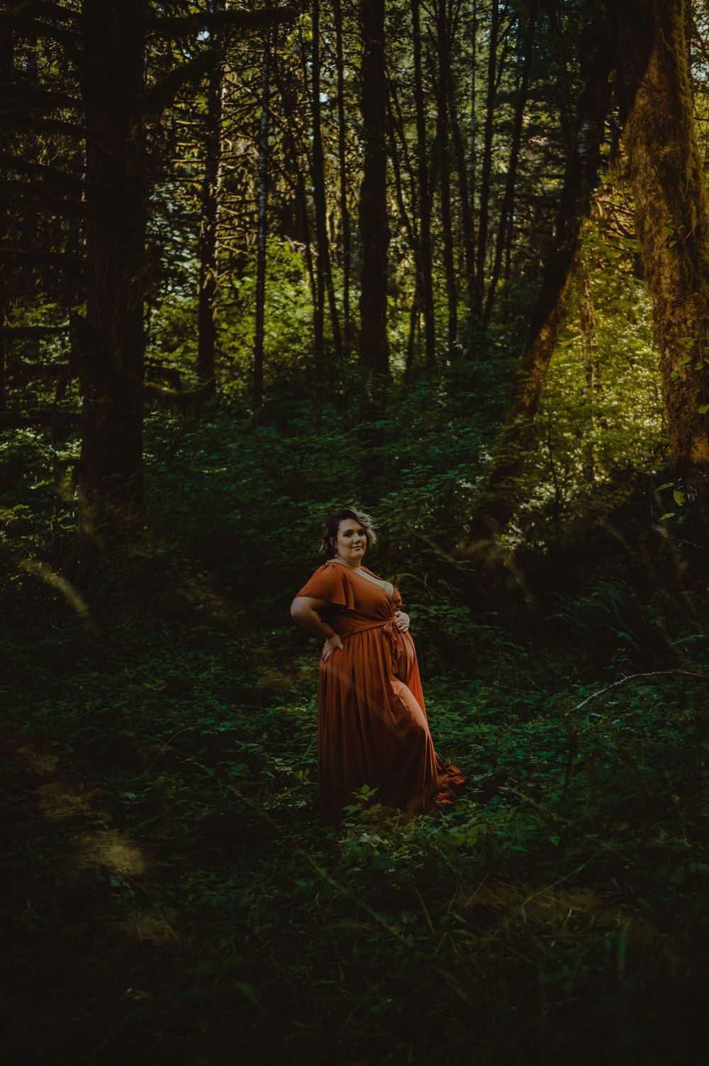 Dreamy forest photography with golden light filtering through the trees.