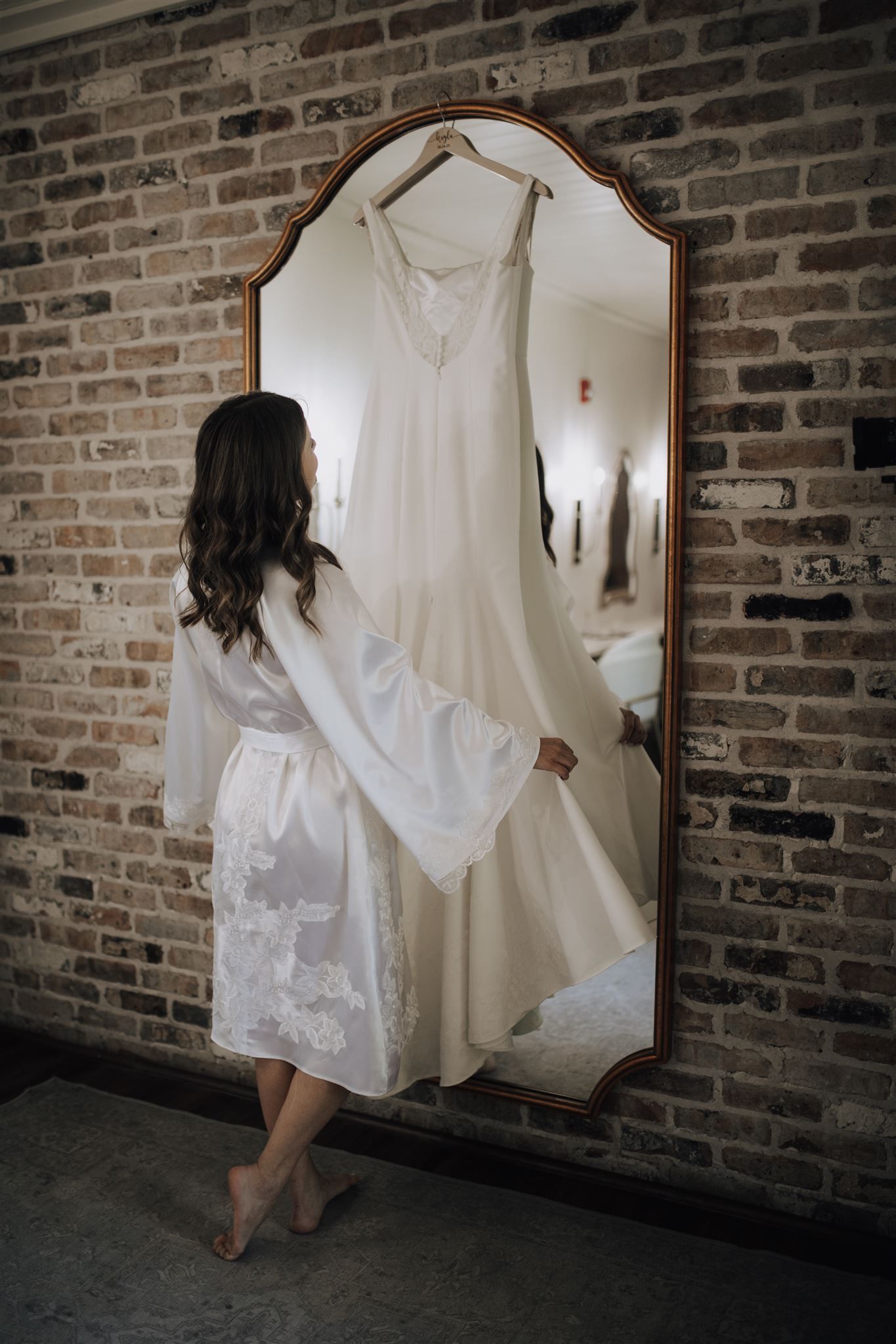 bride and bridesmaids getting ready in suite of Carriage House wedding venue in Conroe, Tx