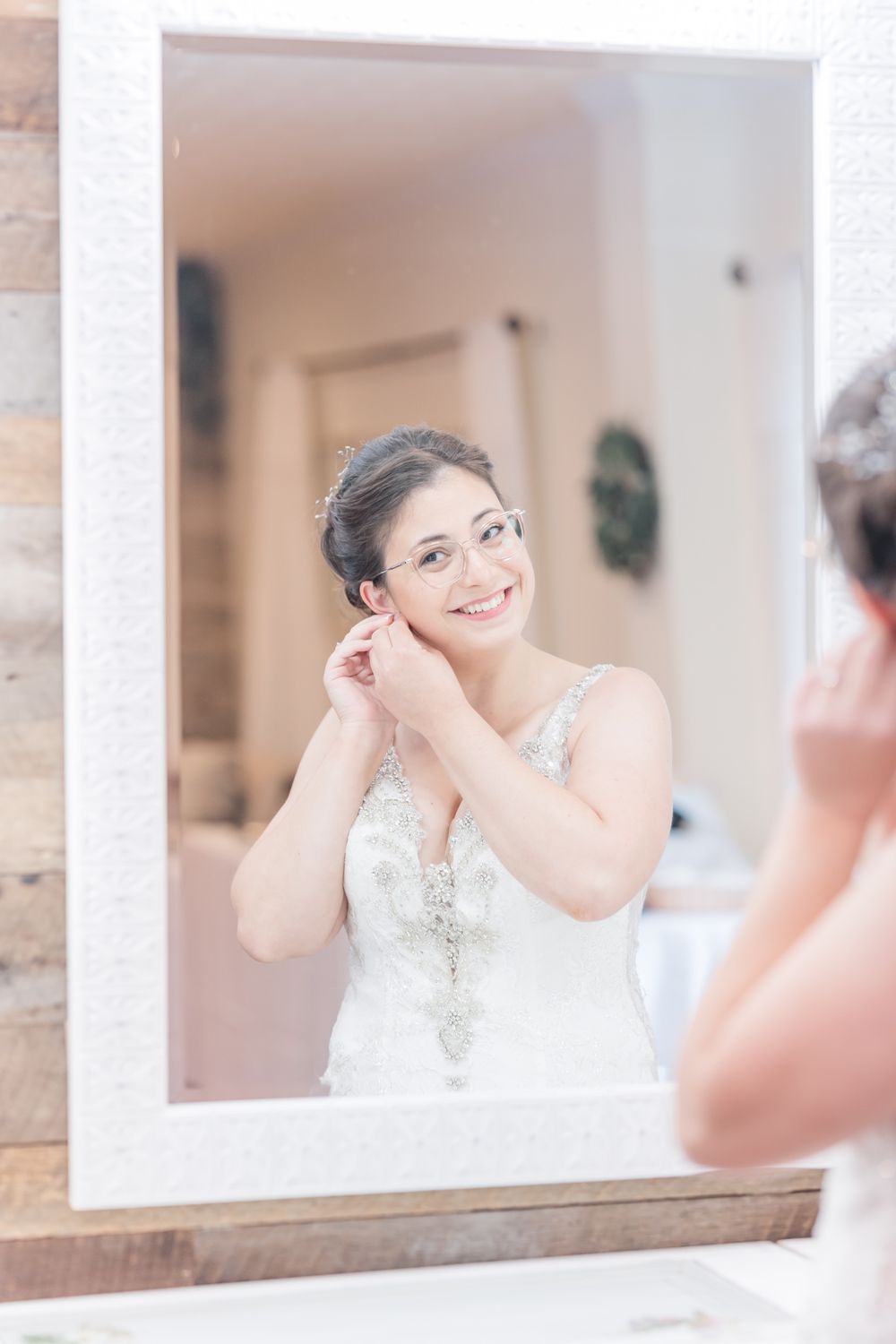 Mirror reflection showing wedding day preparation moment.