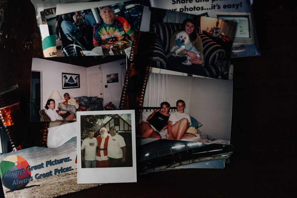 scattered photographs on the table