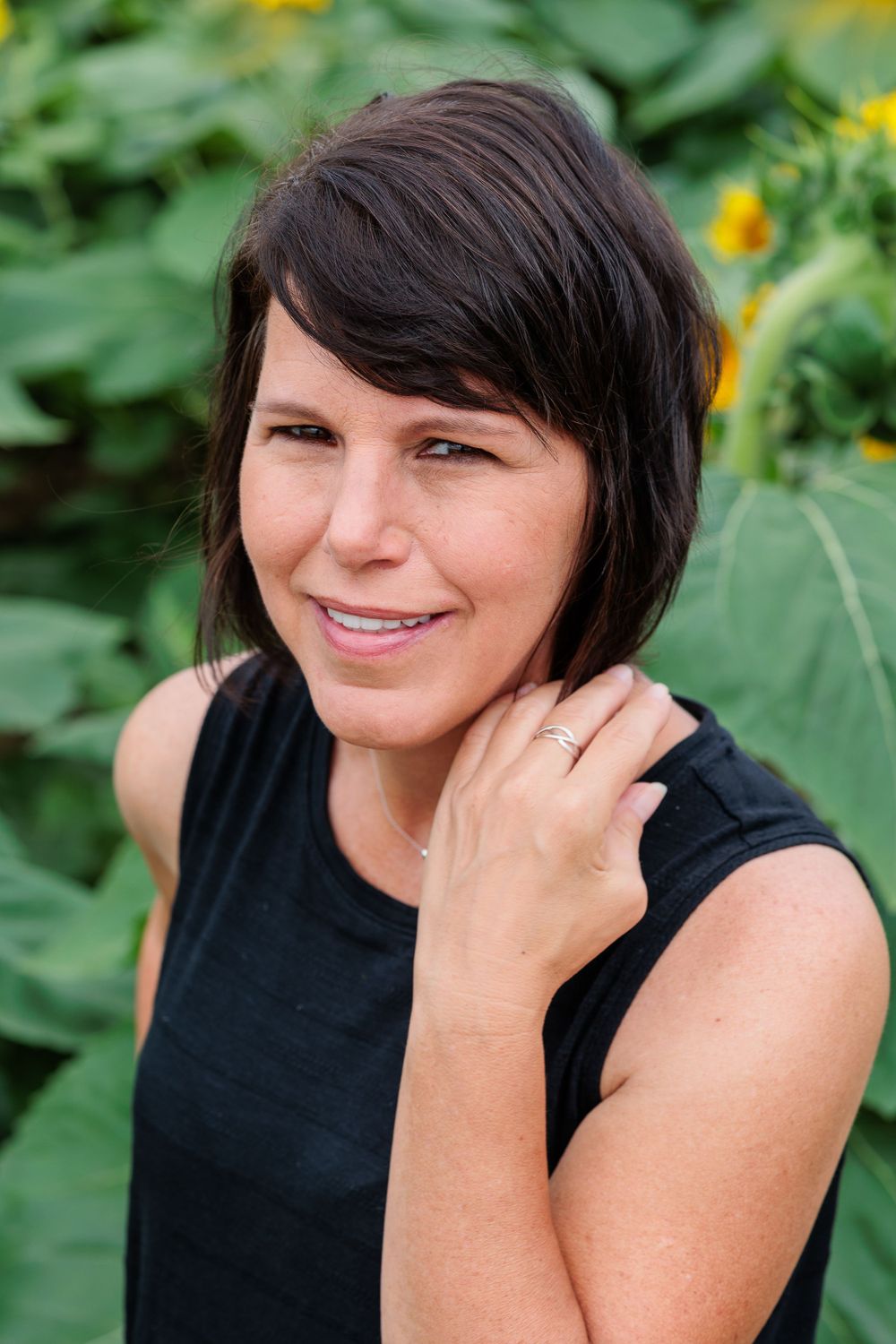 Portrait sequence showing expressions against a green garden background.