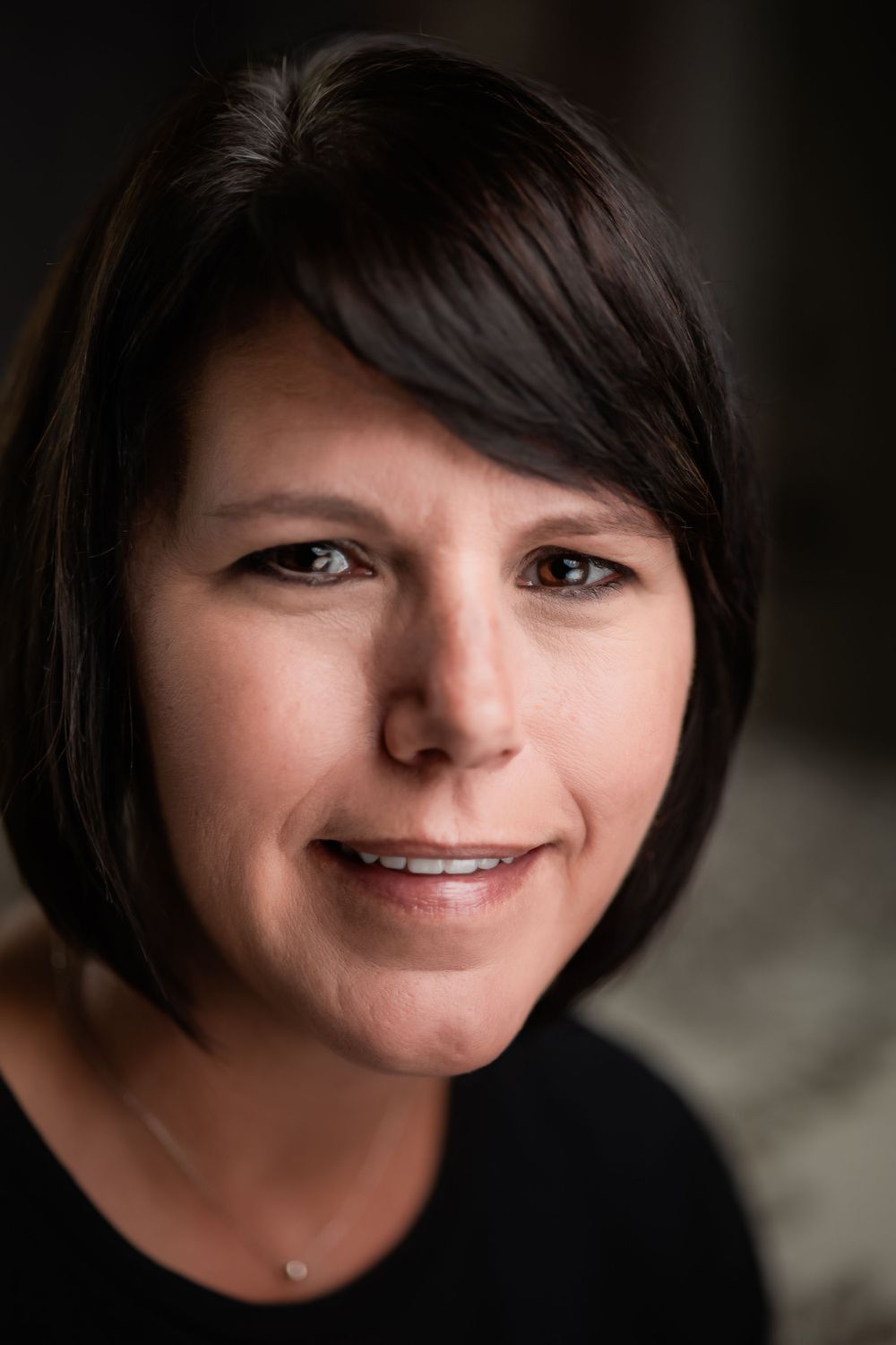Close-up portrait series showing different expressions with short dark hair.