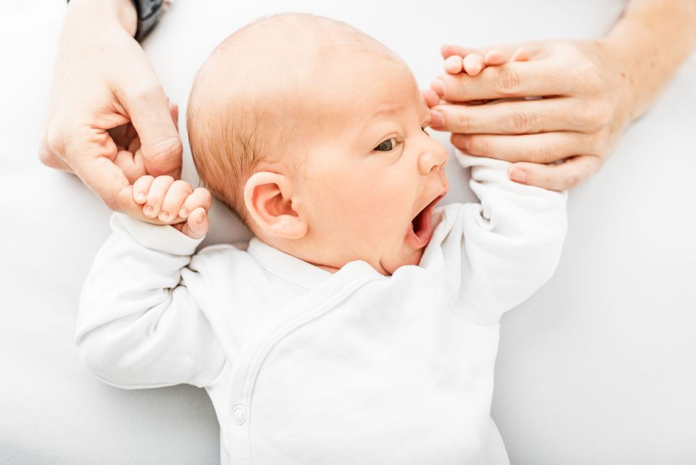 Natural newborn photography in home all-white studio Hereford