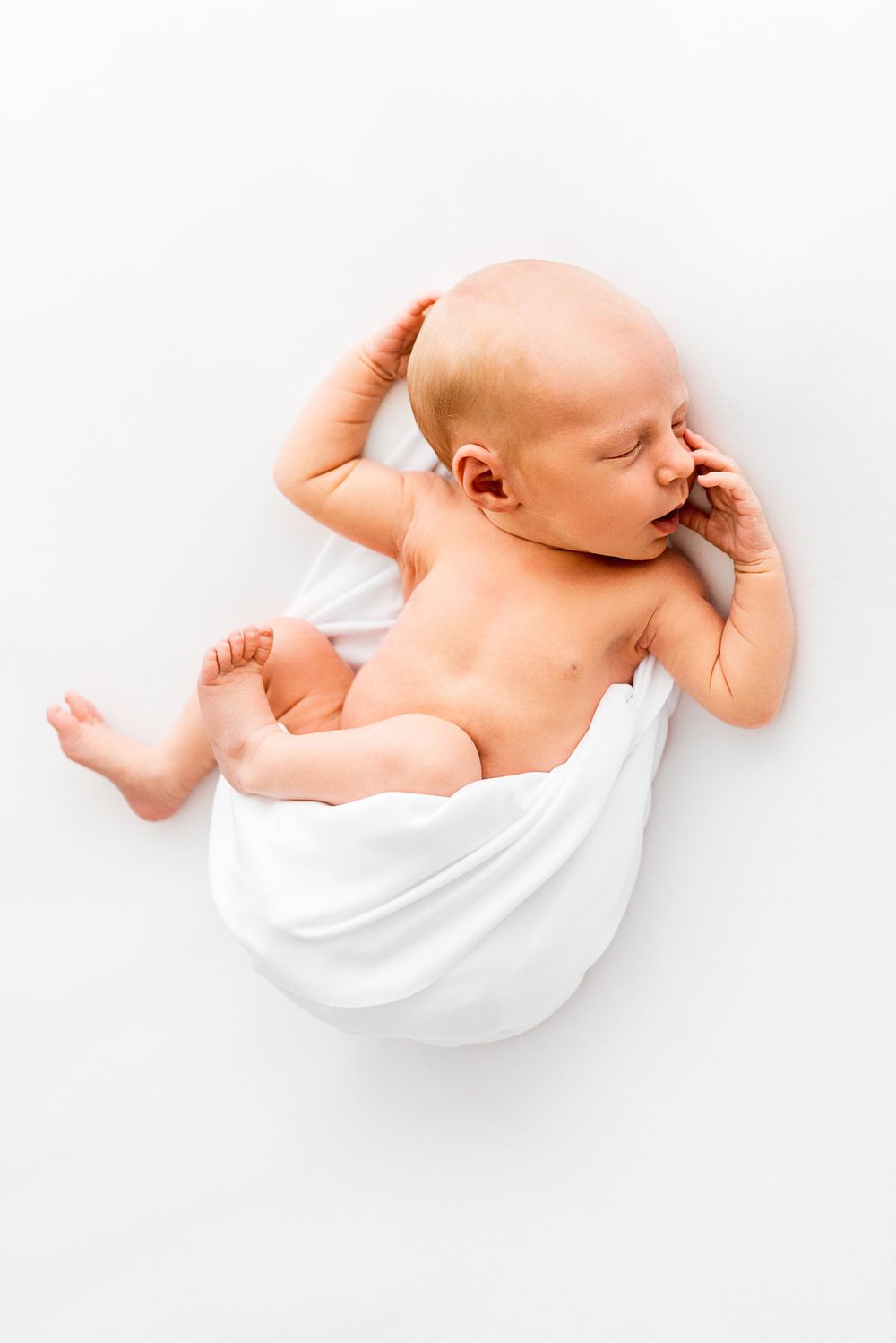 Natural newborn photography in home all-white studio Hereford