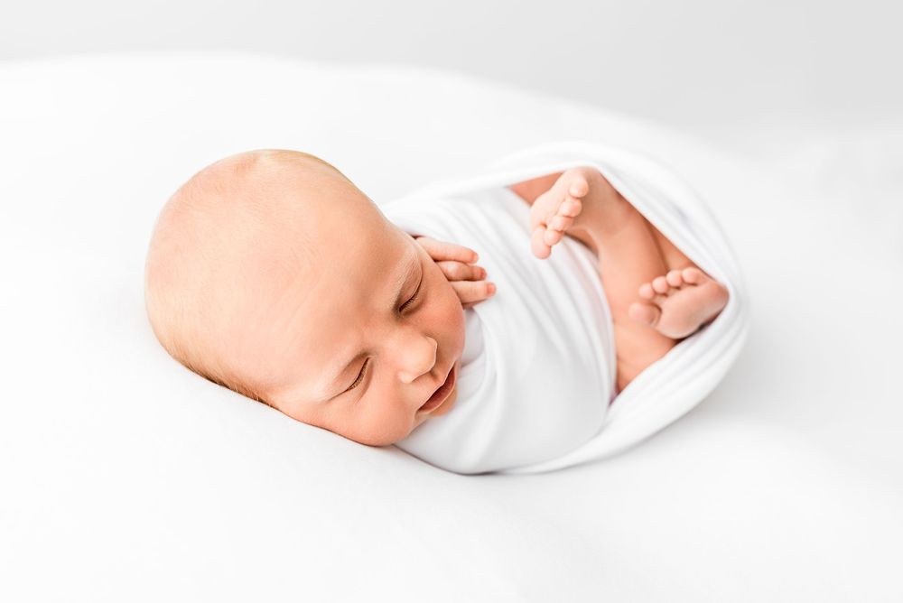 Natural newborn photography in home all-white studio Hereford
