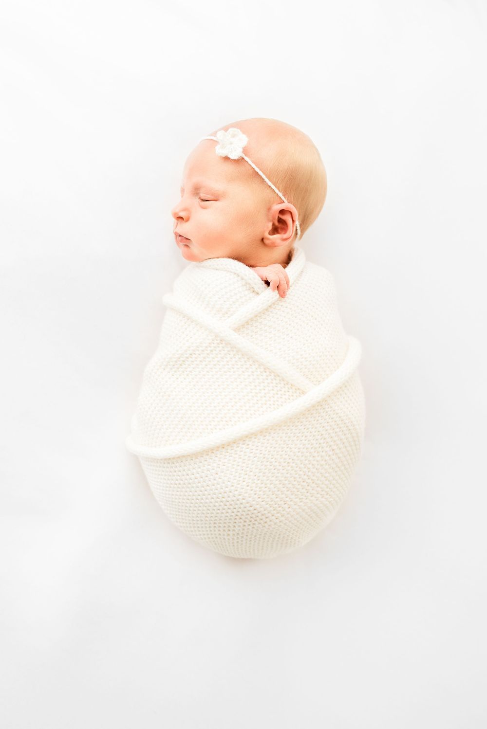 Natural newborn photography in home all-white studio Hereford
