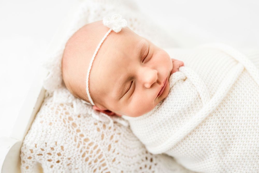 Natural newborn photography in home all-white studio Hereford