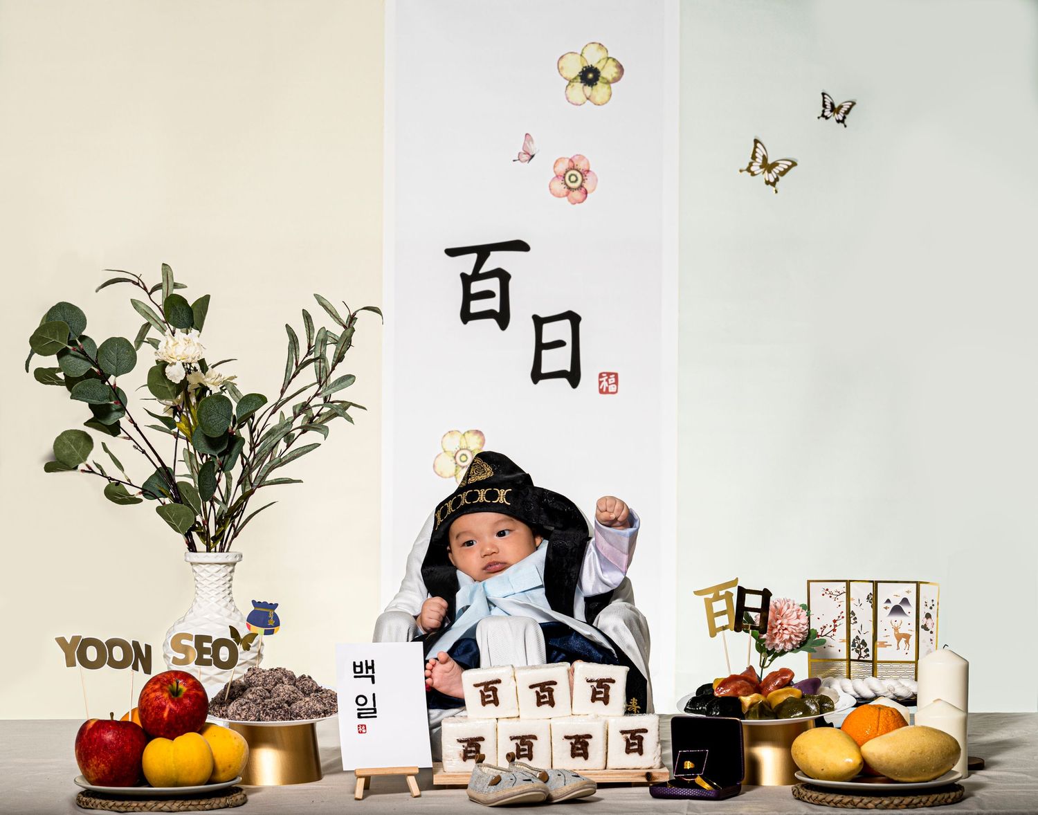 A traditional Korean 100 day celebration setup with fruits, decorations and calligraphy. Scotch Plains Photographer, portrait photography.