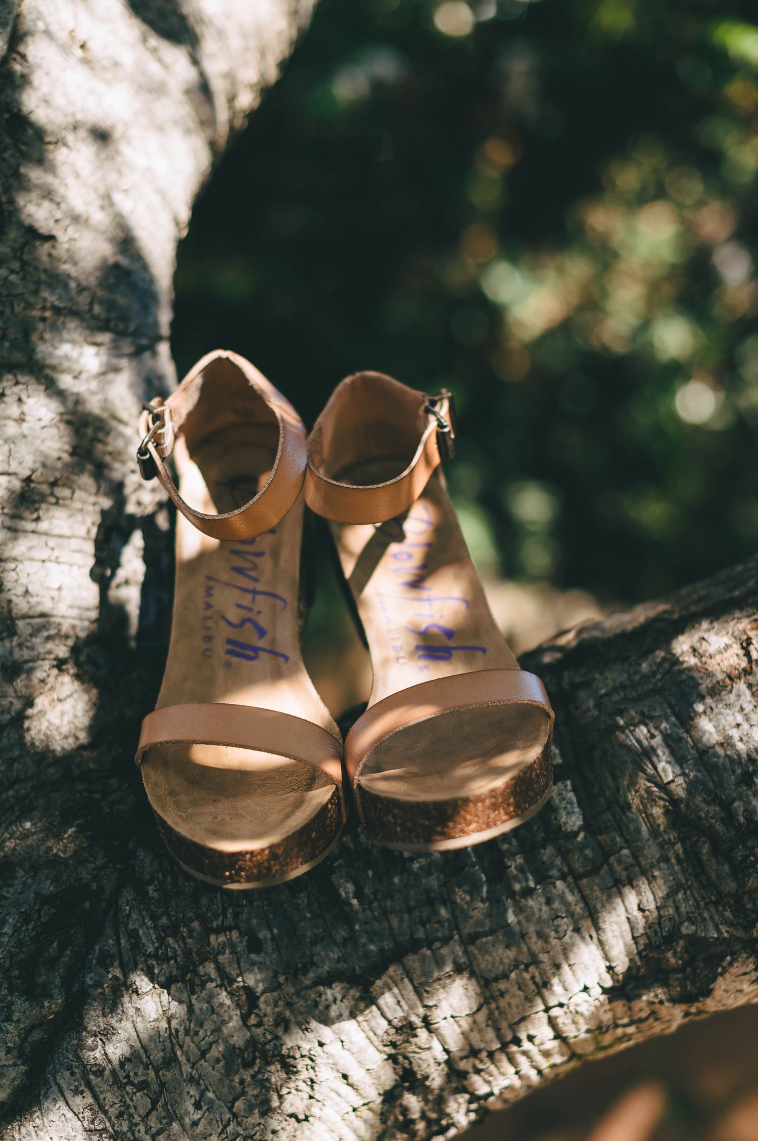 Tan wedge wedding shoes shot outdoors
