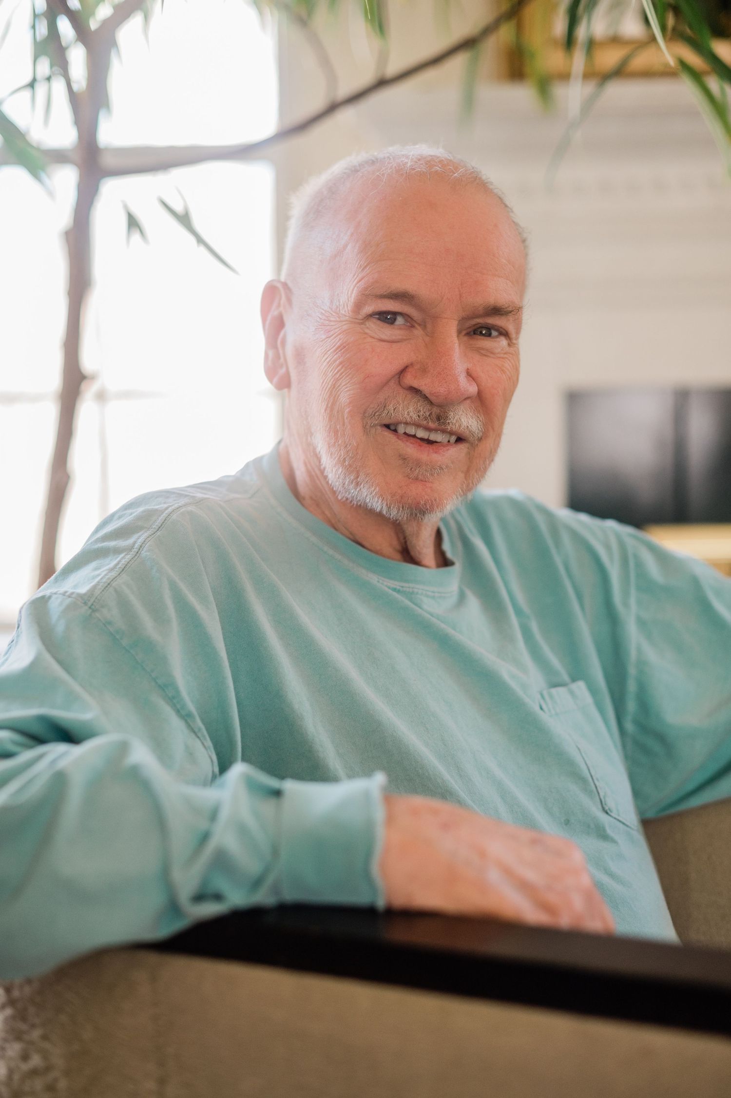 Sequence of candid shots showing a person in a mint green shirt relaxing.