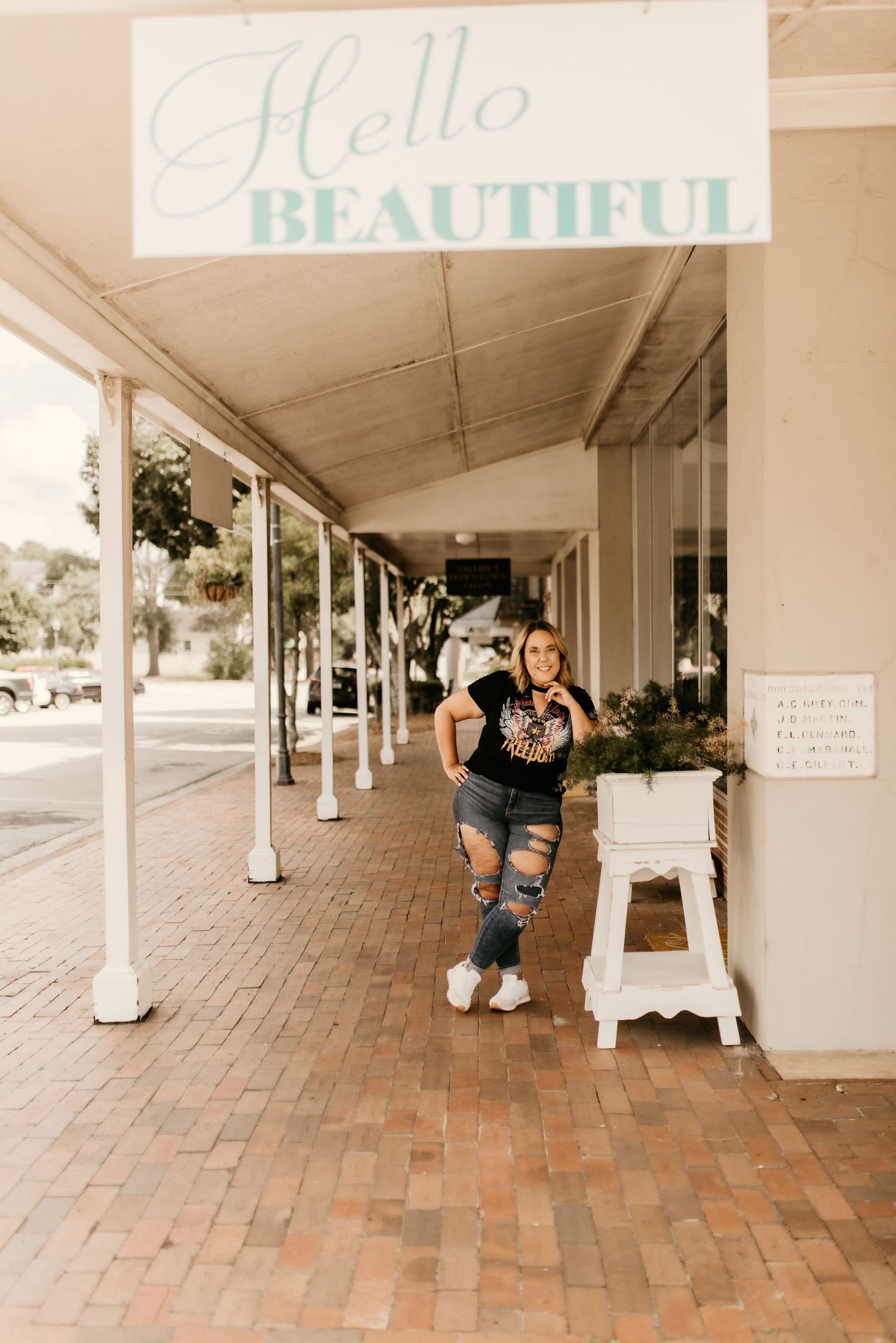 Series of playful portraits taken under a covered brick walkway with white columns.