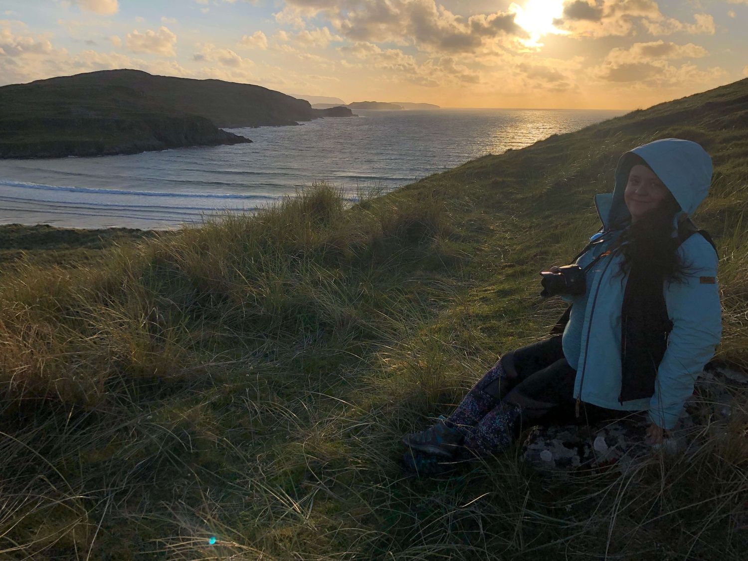 Photographer At Work On The Cliff Above Bay - Photo by © Reka Csulak Three Pod Studio