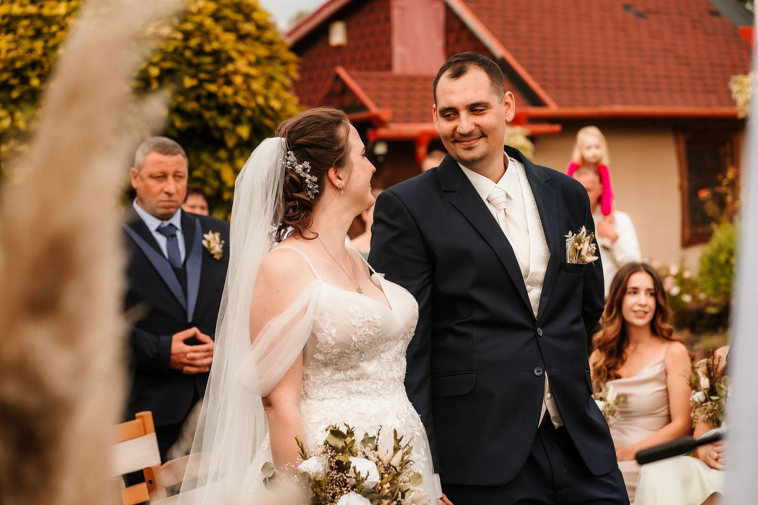 Couple shares a moment during their garden wedding ceremony.