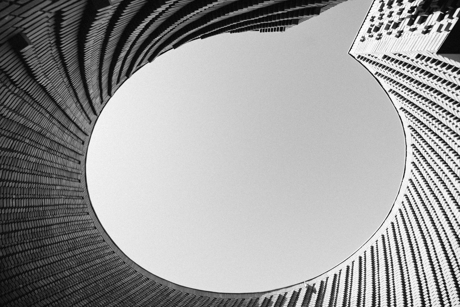 Abstract architectural detail showing spiral pattern leading to circular skylight.