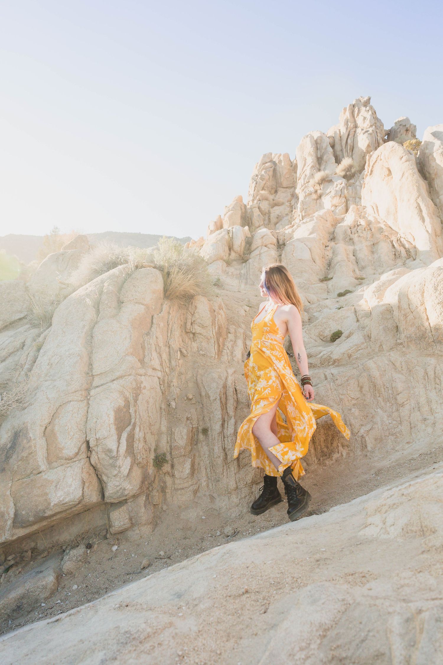 Moon Rocks Desert Nevada Senior Photo with pink and blue hair and yellow Free People Dress and Dr. Marten boots