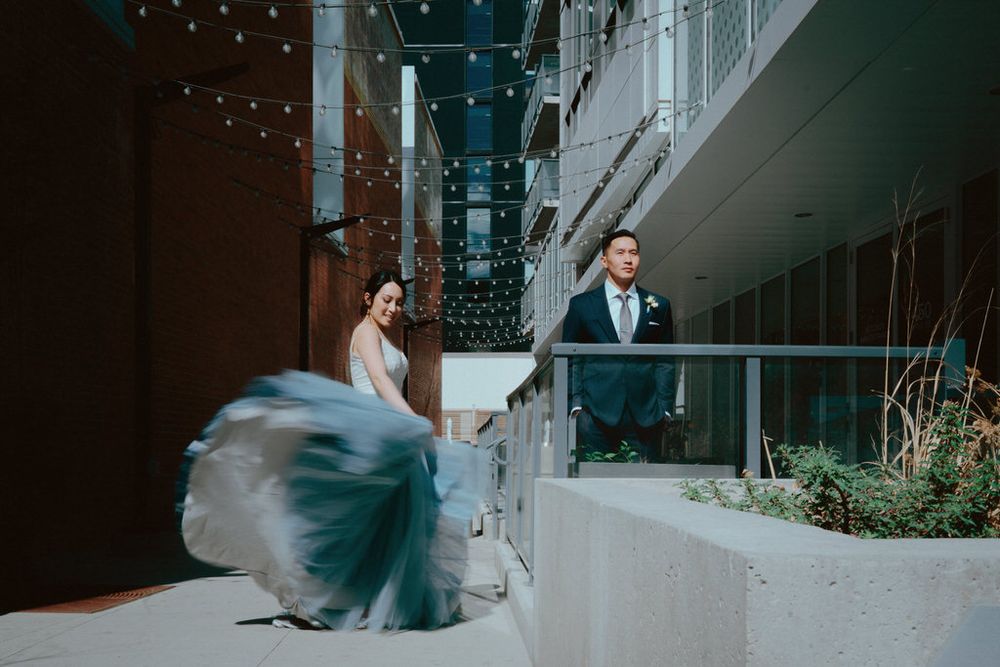 Bride and groom embracing on their wedding day with scenic backdrop | Calgary wedding photographer capturing romantic, timeless moments.Brid