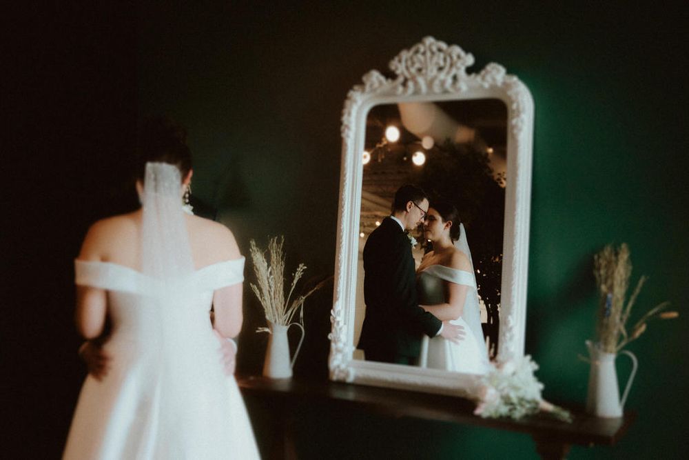 Bride and groom embracing on their wedding day with scenic backdrop | Calgary wedding photographer capturing romantic, timeless moments.
