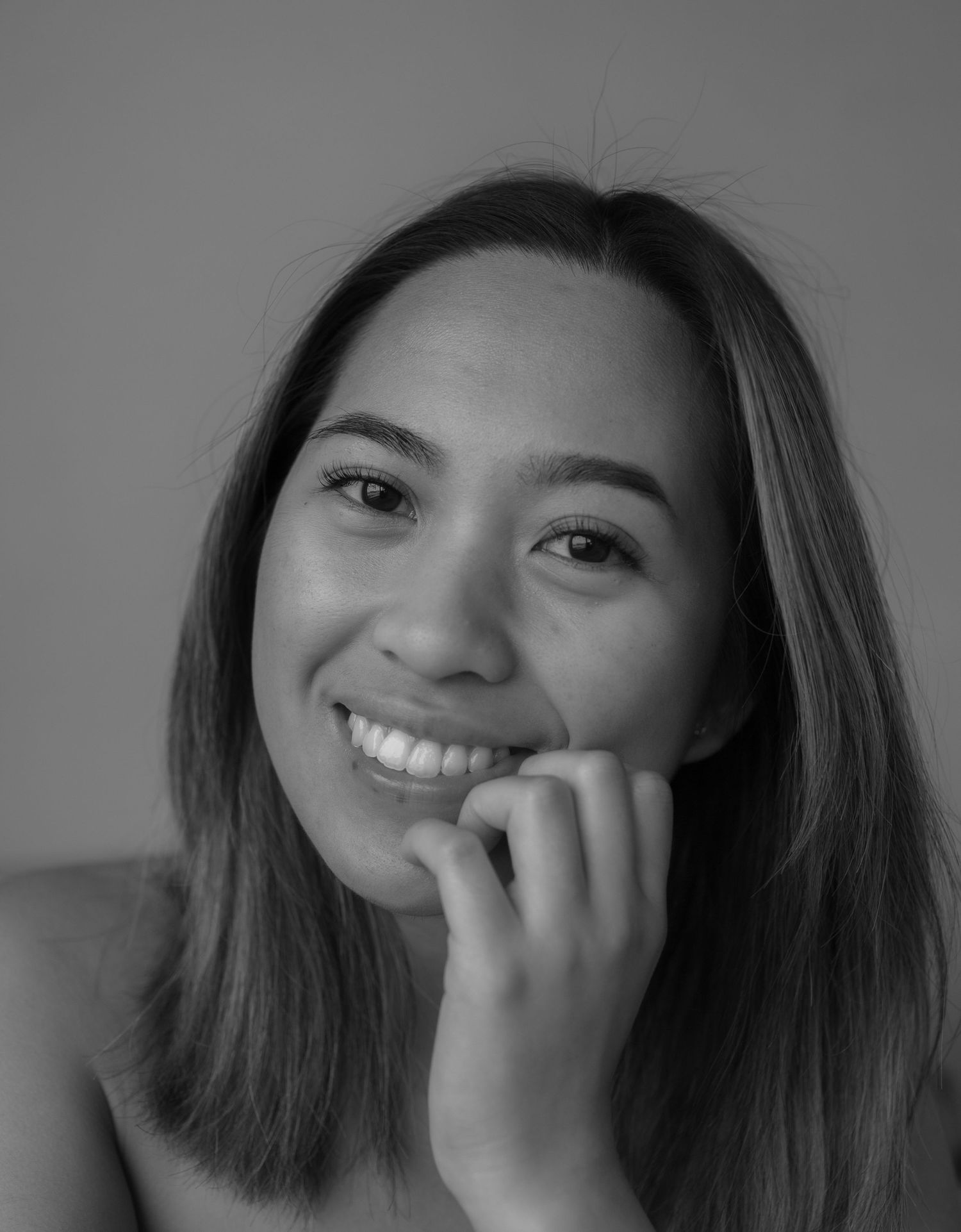 A series of black and white portrait shots showing various expressions and poses.
