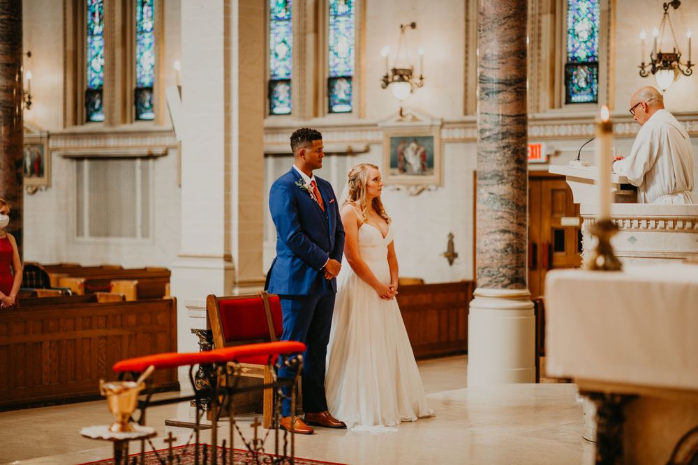 Bride and groom standing together at the altar during their church wedding ceremony.