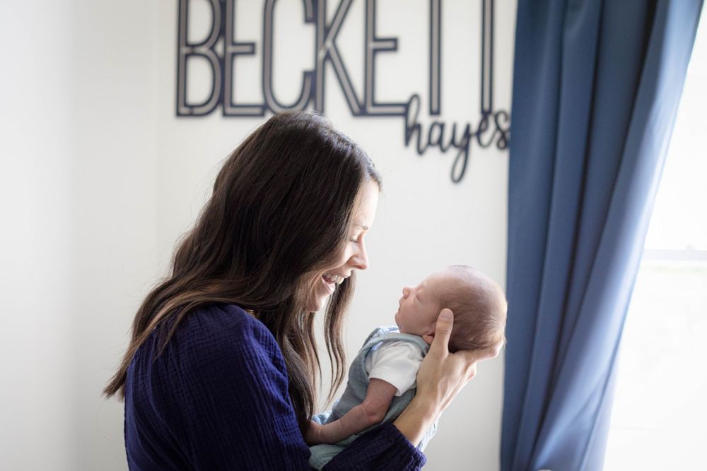 newborn and mom in nursery by victoria leigh photography
