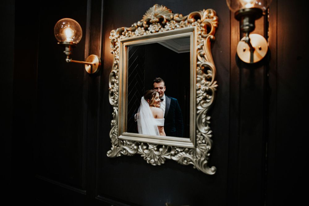 Crowcombe Court Wedding Photography in Somerset | creative bride and groom portraits through the mirror
