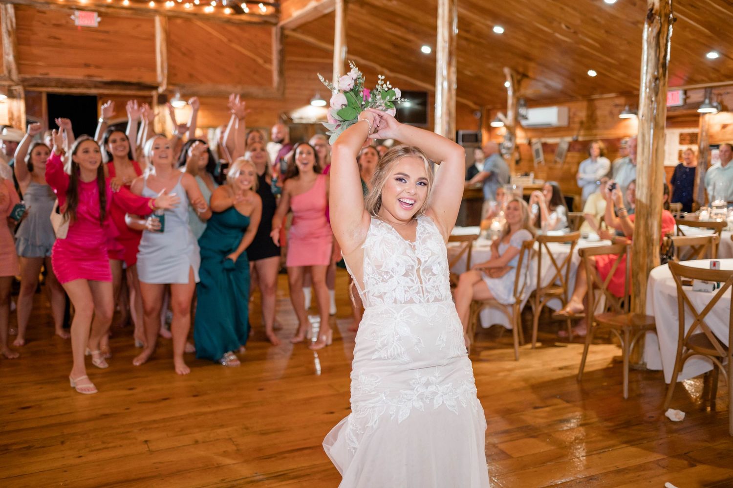 bride throwing bouquet