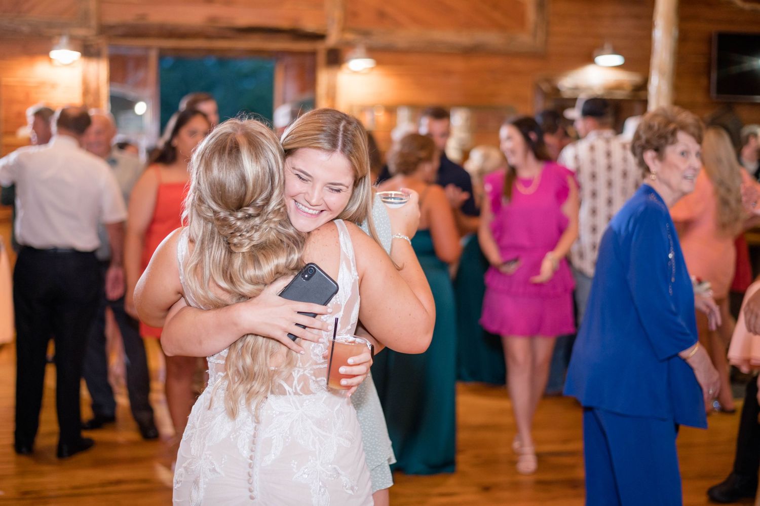 bride hugging guest