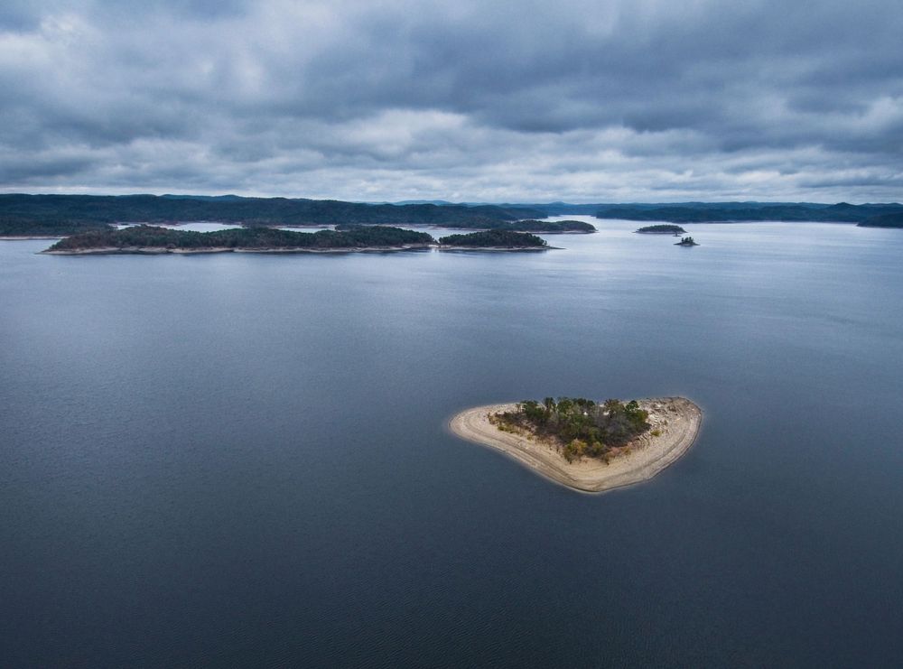 A storm moves over a group of small islands in Broken Bow Lake in Oklahoma.