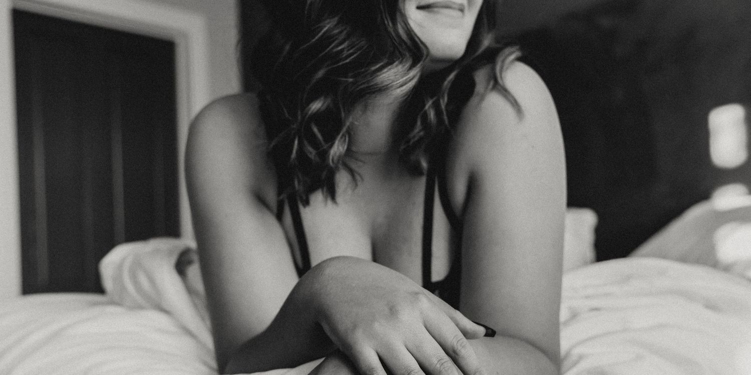 Intimate black and white portrait showing natural curves and shadows.
