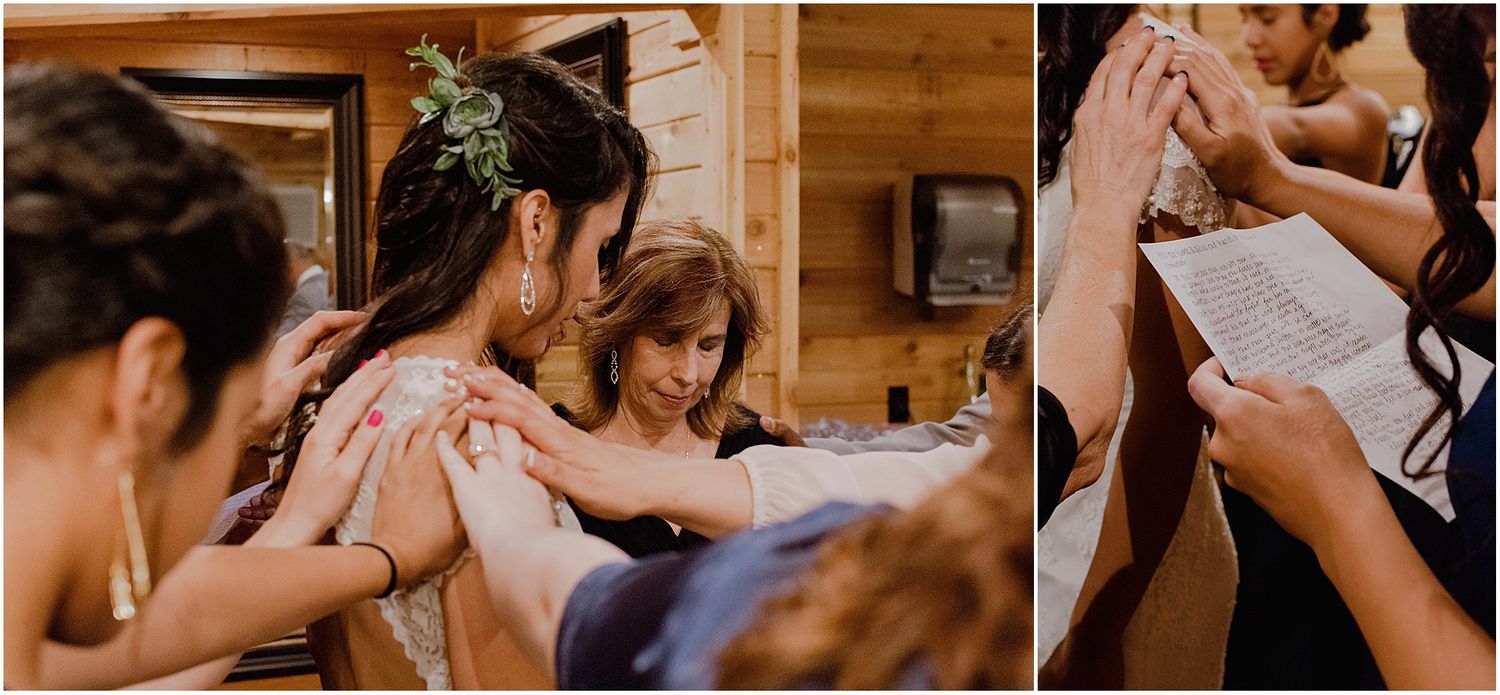 Wedding party helping each other get ready in a rustic cabin setting.