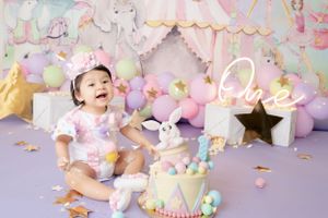 Whimsical birthday setup featuring unicorn theme with pastel decorations, balloons, and sparkly accents.