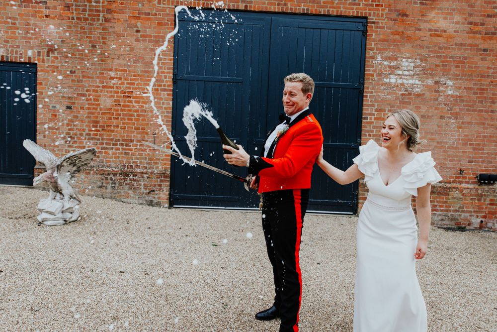 champagne popping , couple portraits , bury court barn wedding