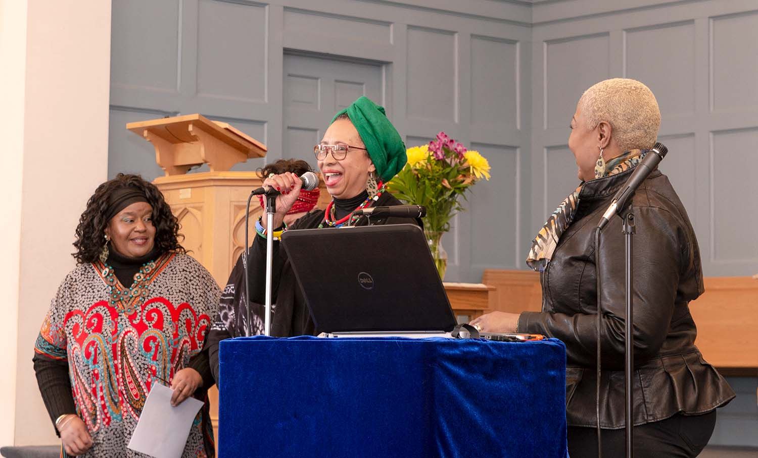 Pixs By Tina captured three ladies gathered around a table during memorial service for Charles B Ford at Good Shepherd Church