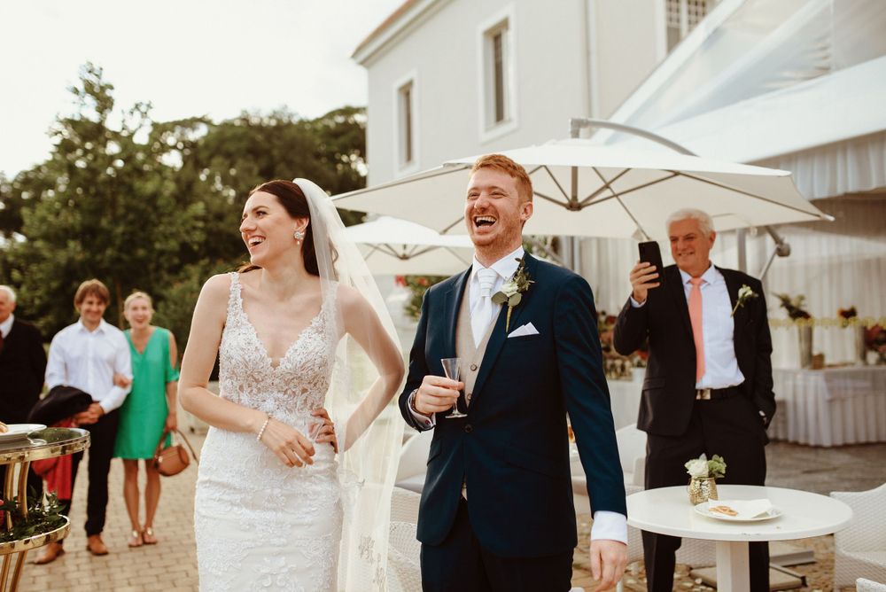 groom smiling near bride