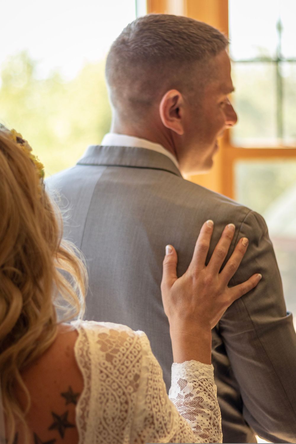Close-up shots of tender moments between a couple in wedding attire.